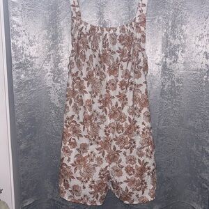 Floral romper with back cut-out. Never worn